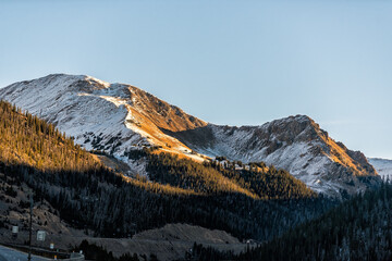 Silverthorne, Colorado to Western Slope snowcapped rocky mountains in winter weather sunrise...