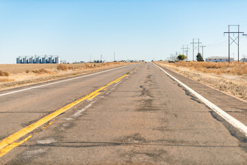 Anton, Colorado on US 36 highway and desert barren landscape blue sky driving car point of view