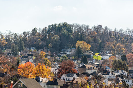 Clarksburg, West Virginia small rural town in countryside, homes, houses buildings in Appalachian mountains, rolling hills landscape in autumn fall - Powered by Adobe