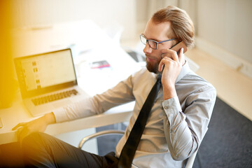 Businessman, financial advisor or talking with phone call for customer service, help or consulting...