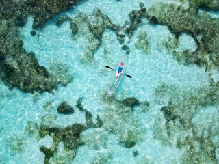 Woman in a transparent kayak