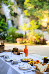 Outdoor picnic near waterfall