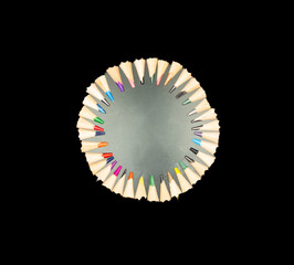 Circular Arrangement of Color Pencil Tips on Reflective Surface – A Vibrant and Geometric Display of Creativity and Precision