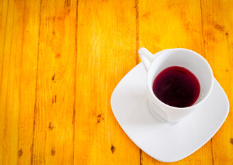 cup of coffee on wooden table