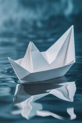 Obraz premium Simple origami paper boat floating on water, symbol of calm and tranquility.
