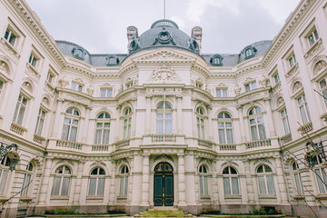 Fototapeta premium Neoclassical Palace in Brussels, Belgium - Ornate Architectural Facade with Symmetrical Windows, Columns, and Elegant Detailing