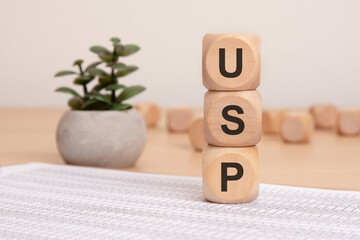 A stack of three wooden cubes with the letters 