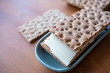 crispbread with cheese slice on the table in slow motion