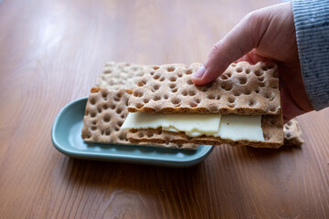 crispbread with cheese slice on the table in slow motion