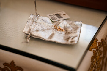 Elegant Silver Pouch on Glass Surface