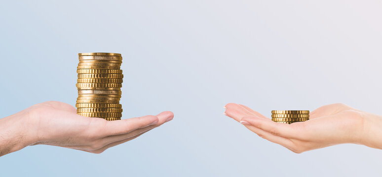 Gender pay gap, sexism at bookkeeping. Male hand holding more money then female, panorama, free space