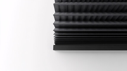 detailed view of black pleated blinds against a white wall

