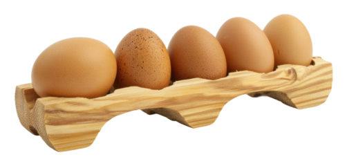Brown eggs arranged in a wooden tray isolated on transparent background