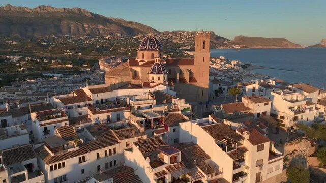 City of Altea on a picturesque Mediterranean coast in Spain. Sunset time and Ancient church of Altea, Alicante, Spain.