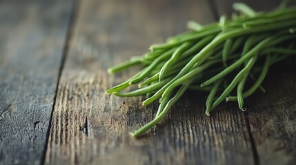 Fresh string beans on rustic wooden table, natural light, vibrant green tones, shallow depth of field for texture and detail
