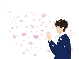 舞う桜の花びらを手にする人