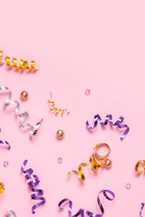 Shiny spirals on pink background with place for text. Festive background.