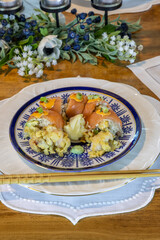 Lobster tempura sushi with avocado and ginger with chopsticks