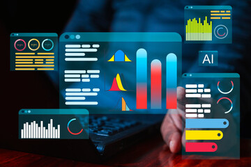 Businessman working on a laptop with a holographic interface for big data analytics, artificial...