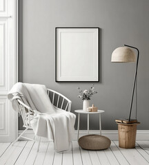 Scandinavian reading corner with a white armchair, cozy blanket, and an empty poster frame mock-up on a gray wall for wall art display
