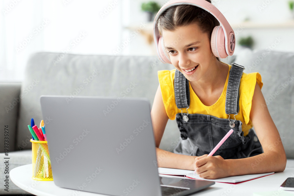 Poster educational lecture. portrait of smiling girl in pink headphones sitting on couch at table using lap