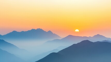 Fototapeta premium As daylight fades, a beautiful sunset blankets the mountain range in warm hues, creating a peaceful ambiance and stunning silhouettes