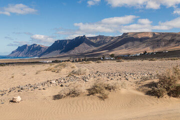Volcanic Mountains/An image of a range of volcanic mountains called Risco De Famara which are said to be sixteen million years old, shot from Playa De Farmara, Lanzorote, Canary Islands, Spain.