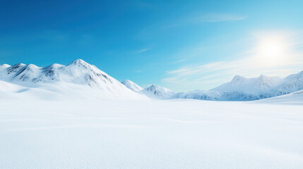 Fototapeta premium serene snow covered landscape with mountains under clear blue sky, evoking sense of tranquility and vastness