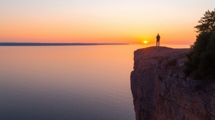 Solitary Figure at Scenic Sunset by the Water Edge