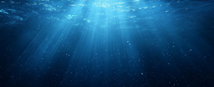 Underwater sunbeams, ocean depth, background particles, serene backdrop