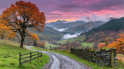 Autumnal valley road sunrise, misty mountains
