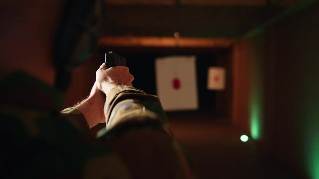 Man enjoying recreational shooting experience in firing range, checking if he shot bullseye. Person practicing with weapons in safe environment at shooting range company, hitting targets, camera A