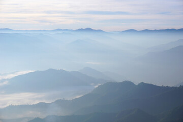 layers of mountains with fog
