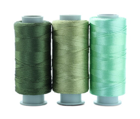 Spools of colorful sewing threads isolated on white