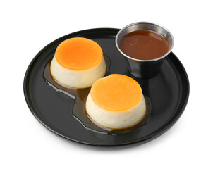 Tasty puddings with caramel sauce isolated on white