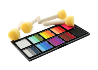 Bright face paint palette and sponges isolated on white