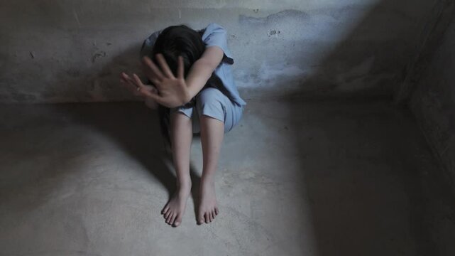 Campaign against human trafficking. Young woman raised her hand telling her to stop domestic violence. Human rights violations.