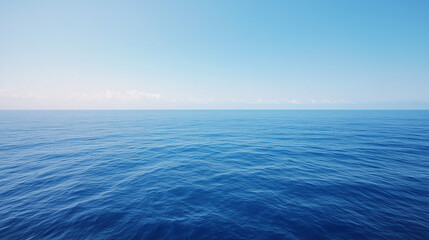 Obraz premium Vast Azure Expanse: A tranquil, azure expanse of the open ocean stretches out beneath a cloudless sky, evoking a sense of serenity and endless possibility.