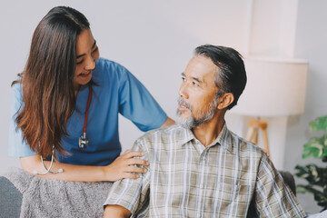 Doctor holding hands of patient at hospital.