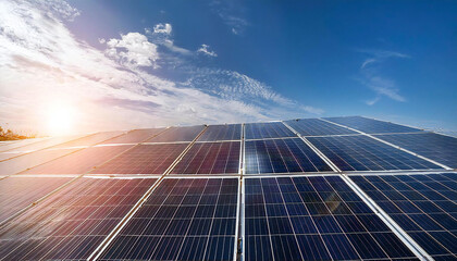 Solar power panels with blue sky and sunlight in the background. Clean and renewable energy. Solar power.