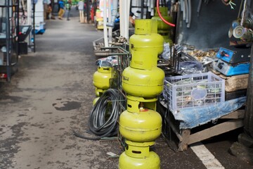 Fototapeta premium Used 3kg Gas Cylinders for Sale at Comboran Scrap Market, Malang City