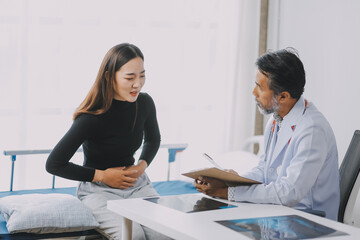 Caucasian woman complaining about her ailments to the doctor
