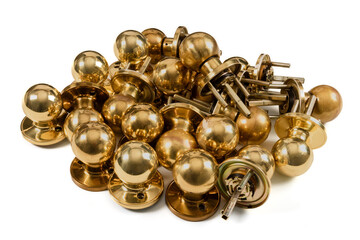 A pile of brass doorknobs isolated on white