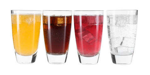 Soda water of different flavors with ice cubes in glasses isolated on white