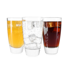 Soda water of different flavors with ice cubes in glasses isolated on white