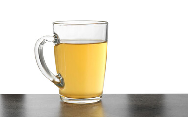 Refreshing green tea in cup on grey textured table against white background