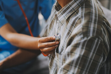 Female doctor listening to heartbeat