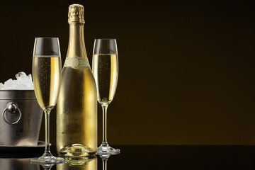 Bottle of sparkling wine, glasses and cooler bucket on black mirror surface. Space for text