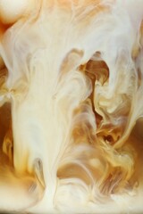 Refreshing coffee with ice and milk as background, closeup