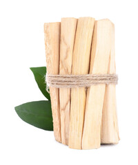 Bunch of palo santo sticks and green leaves on white background